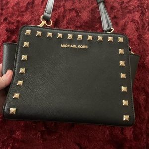 Black Purse with Gold Stud Details and a Shoulder Strap